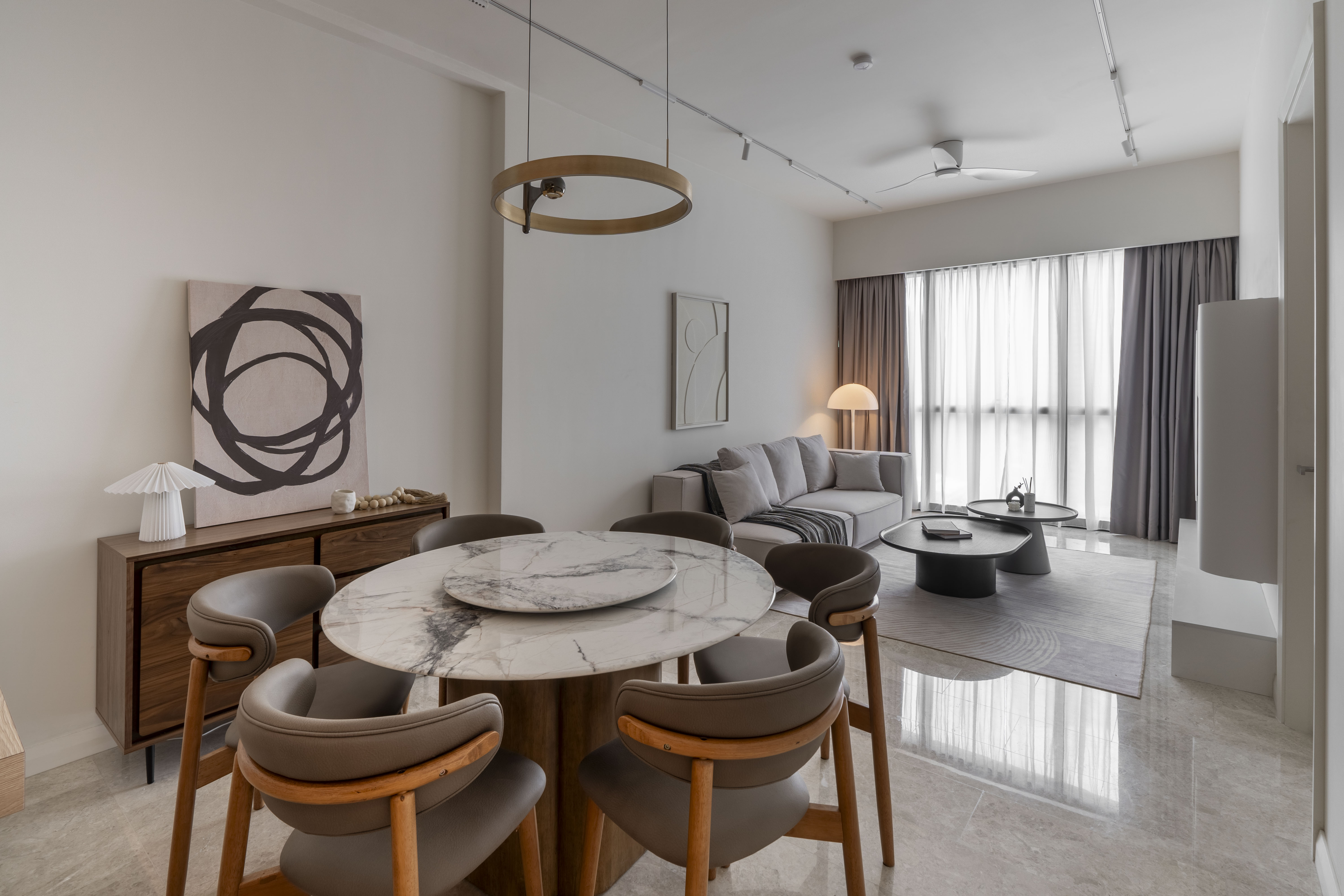 Open-plan dining and living areas with neutral furnishings at TRX Residence, Unit 01