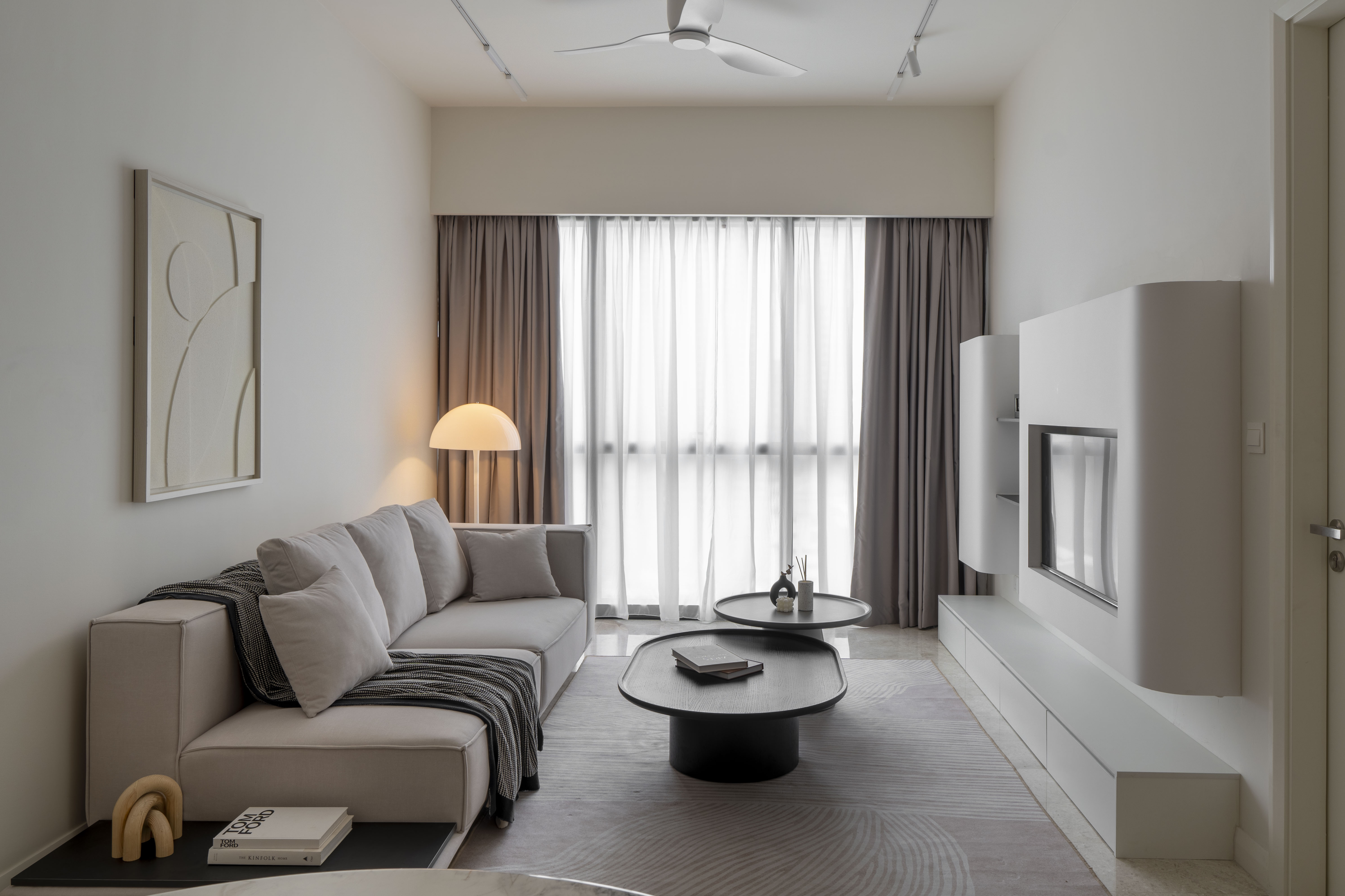 Sofa facing the television wall in the bright living room at TRX Residence, Unit 01