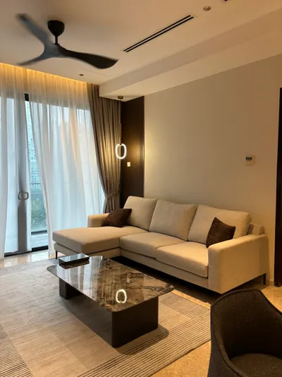 Manor KLCC — Collection B interior photo of sofa, curtain, ceiling, sliding door in living