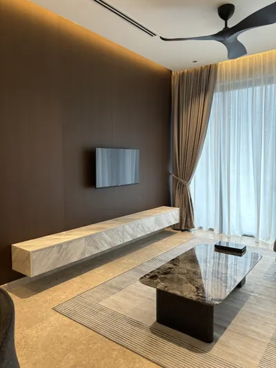 Manor KLCC — Collection B interior photo of TV cabinet, feature wall, curtain, ceiling in living