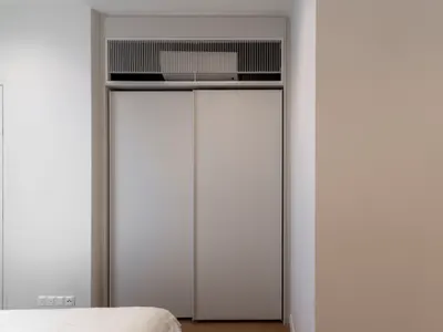 TRX Residence — Home 01 interior photo of wardrobe, sliding door in bedroom