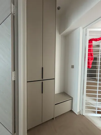 KiaraVille interior photo of shoe cabinet in living