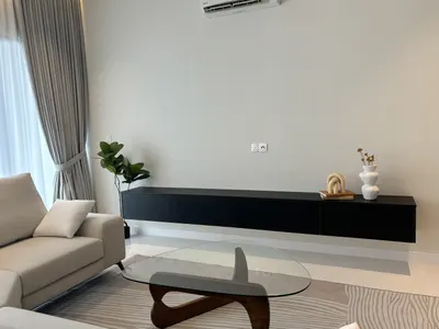 Pavilion Mayfair interior photo of TV cabinet, sofa, curtain in living